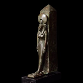 An Egyptian Bronze Lion-Headed Goddess and Obelisk