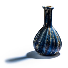 A Roman Marbled Glass Unguentarium