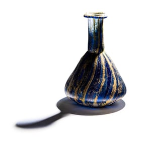 A Roman Marbled Glass Unguentarium
