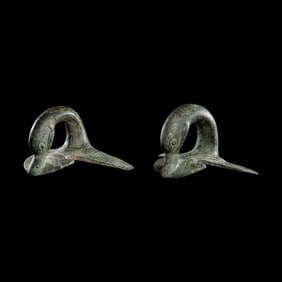 A Pair of Etruscan Bronze Vessel Handles