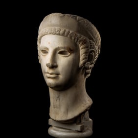 A Roman Marble Archaistic Head of a Goddess