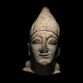 A Cypriot Limestone Votive Head
