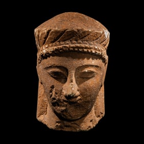 A Cypriot Limestone Votive Head
