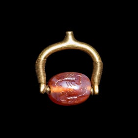 A Phoenician or Cypriot Gold and Carnelian Swivel Ring with Two Scorpions
