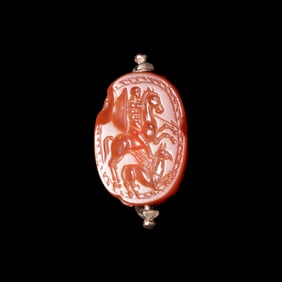 An Etruscan Carnelian Scarab with Warrior on Horseback and a Griffin
