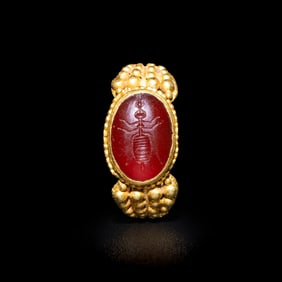 A Late Roman Gold and Carnelian Ring with an Ant Carrying an Ear of Wheat