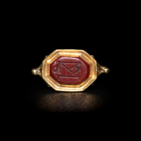 A Late Roman or Byzantine Red Jasper Intaglio with a Monogram