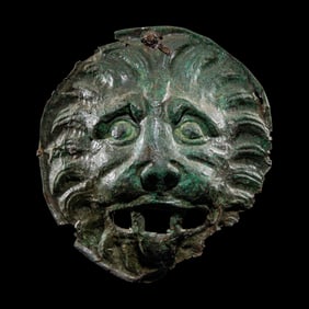 A Roman Bronze Sarcophagus Mask in the form of a Lion