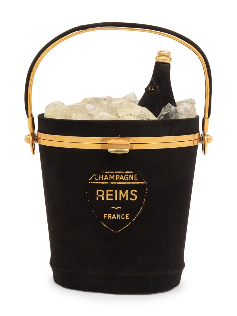 ANNE-MARIE, CHAMPAGNE BUCKET BAG: ANNE-MARIE, CHAMPAGNE BUCKET BAG Sold in Anne-Marie's shop in the Hôtel Meurice, the Champagne bucket purse was also gifted to VIP guests of the hotel, placed in their suites to be found on their