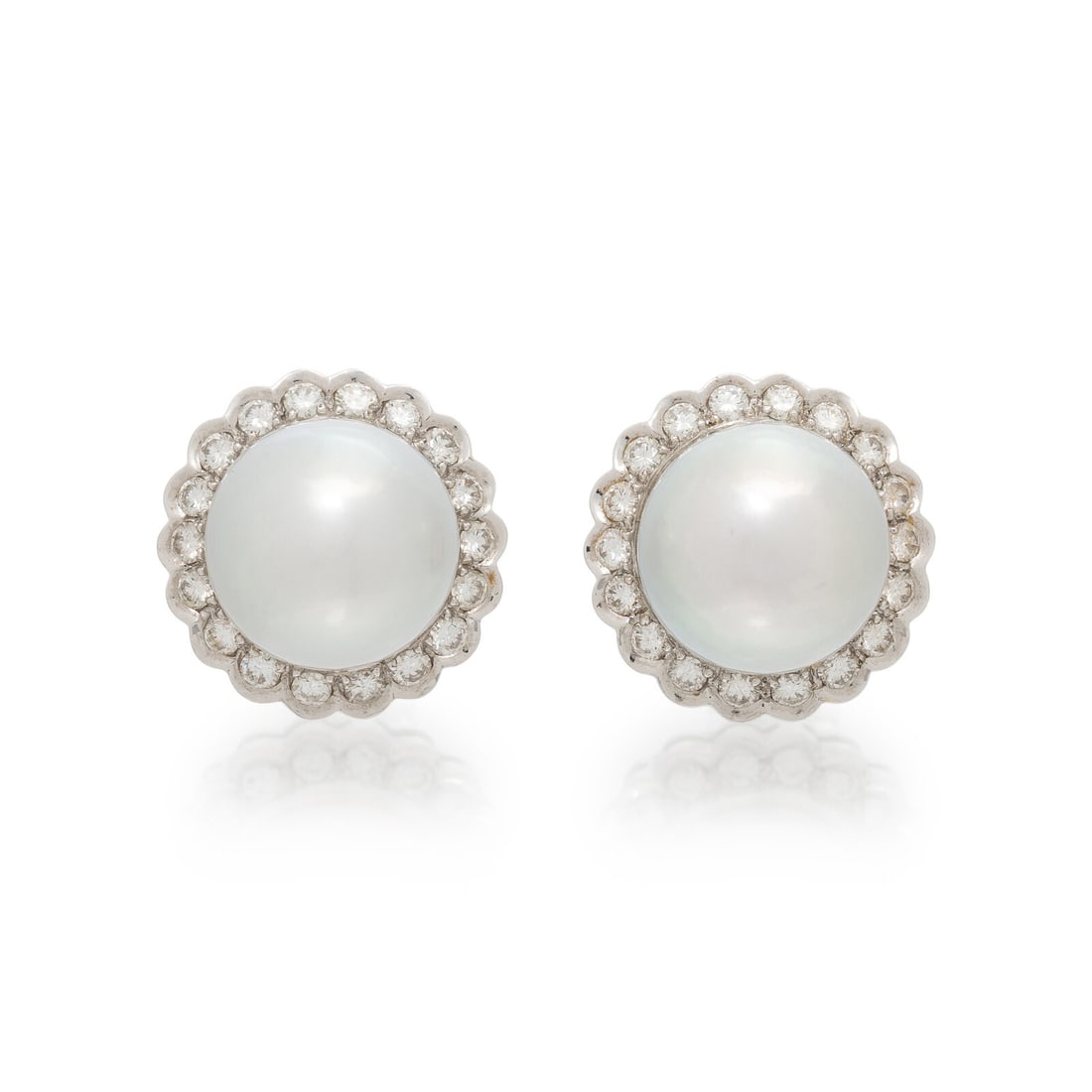 CULTURED PEARL AND DIAMOND EARRINGS: CULTURED PEARL AND DIAMOND EARRINGS Cultured pearls measuring approximately 12.20 mm and round diamonds weighing approximately 0.70 carat total. 18 karat white gold. 3/4 inch long. Stamp: 18K 750 (mak