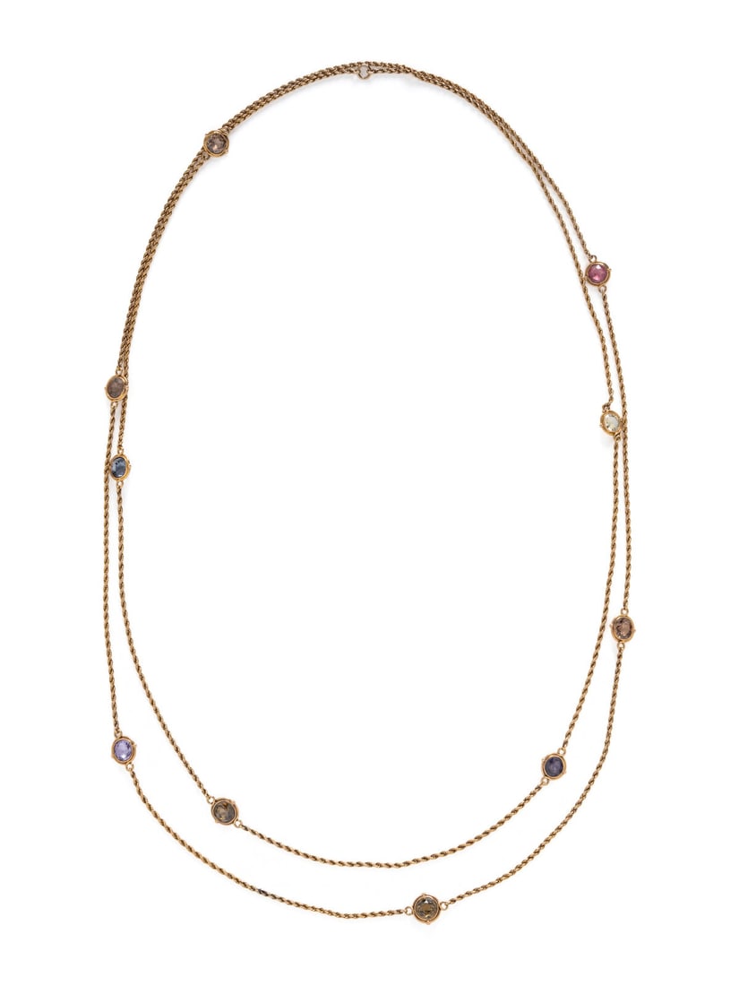 YELLOW GOLD AND MULTIGEM STATION NECKLACE: YELLOW GOLD AND MULTIGEM STATION NECKLACE Various round gemstone stations including spinel, sapphire, garnet, and zircon. Yellow gold. 54 inches long. Gross weight: 12.00 dwt. Property from the Collec
