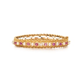 PINK SAPPHIRE, SEED PEARL, AND YELLOW GOLD BANGLE BRACELET