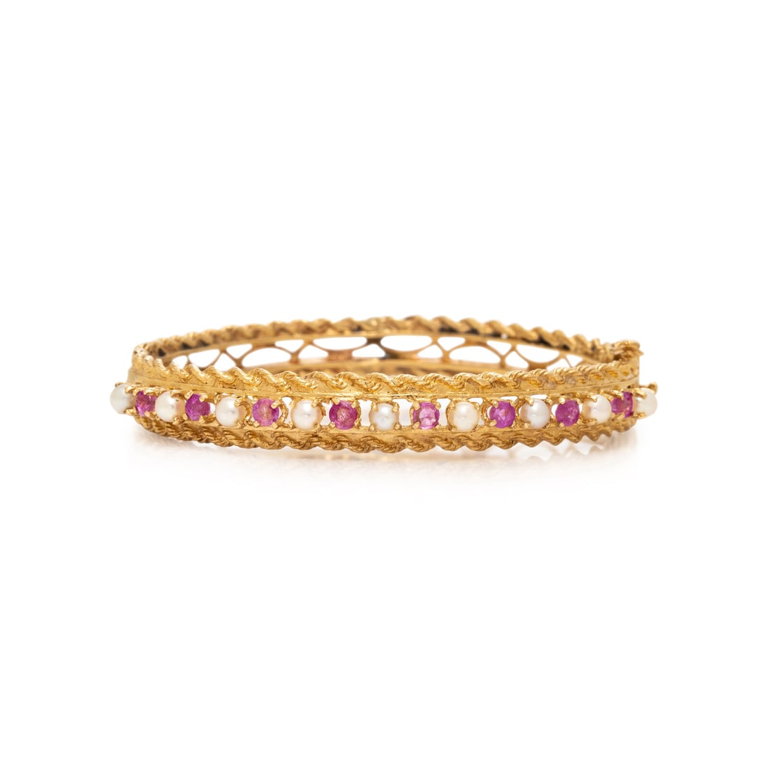 PINK SAPPHIRE, SEED PEARL, AND YELLOW GOLD BANGLE BRACELET: PINK SAPPHIRE, SEED PEARL, AND YELLOW GOLD BANGLE BRACELET Round pink sapphires measuring approximately 3.00 mm and cultured pearls measuring approximately 3.30 mm, hinged with side clasp. 14 karat ye
