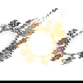 YELLOW GOLD CHARM BRACELET: YELLOW GOLD CHARM BRACELET Fourteen charms total, variously set with gemstones including diamonds, seed pearls, cultured pearls, rubies, and enamel. Yellow and white gold. 6 1/2 inches inner circumfer