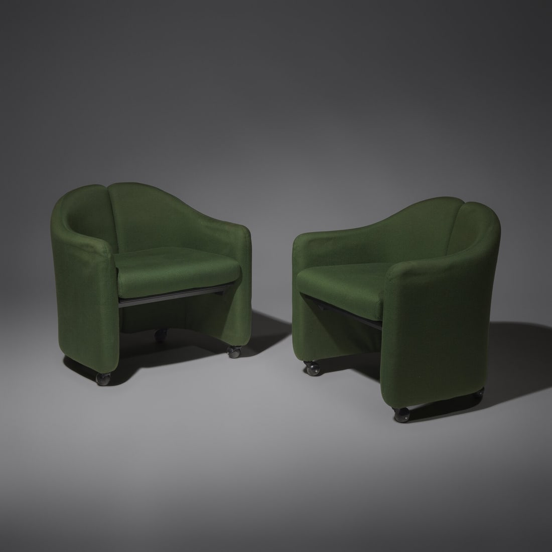 Eugenio Gerli (Italian, 1923-2013) Pair of Italian split-back lounge chairs for Tecno, c. 1960: Eugenio Gerli (Italian, 1923-2013) Pair of Italian split-back lounge chairs for Tecno, c. 1960 wood, foam, upholstery 26 h × 26 w × 20 d in (66 × 66 × 51 cm) This lot is located in