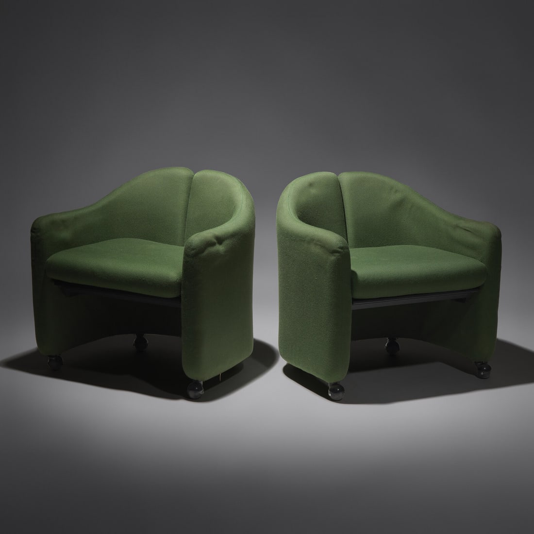 Eugenio Gerli (Italian, 1923–2013) Pair of Split-Back lounge chairs for Tecno, c. 1960: Eugenio Gerli (Italian, 1923–2013) Pair of Split-Back lounge chairs for Tecno, c. 1960 wood, foam, upholstery 26 h × 26 w × 20 d in (66 × 66 × 51 cm) This lot is located in P