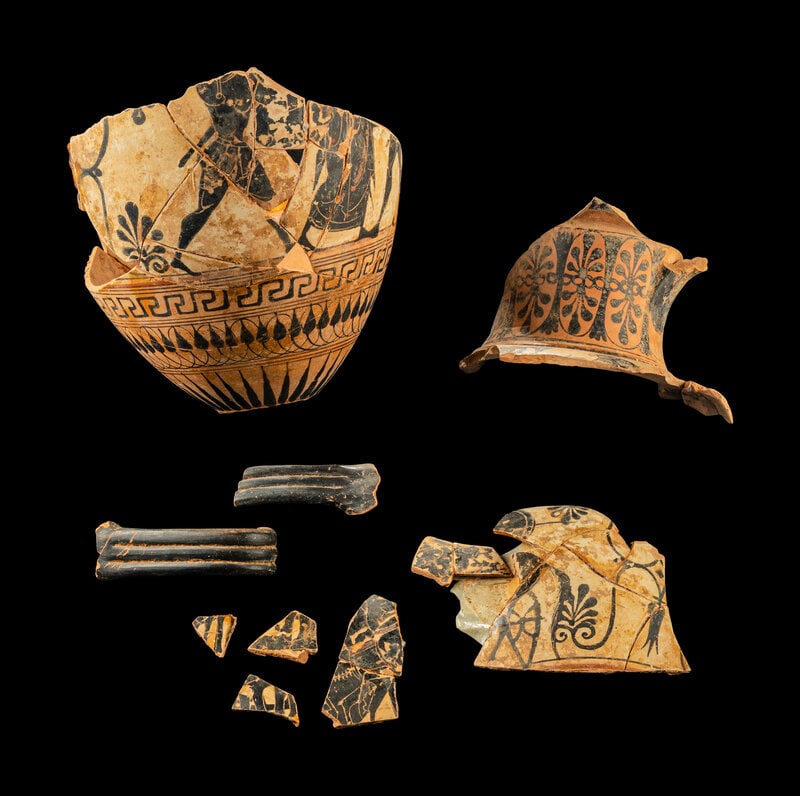 Ten Attic Black-Figured White-Ground Neck Amphora Fragments: Ten Attic Black-Figured White-Ground Neck Amphora Fragments Attributed to the 3 Line Group, Workshop of the Antimenes Painter, Circa 520 B.C. Width of largest fragment 19.5 cm (7 5/8 inches).