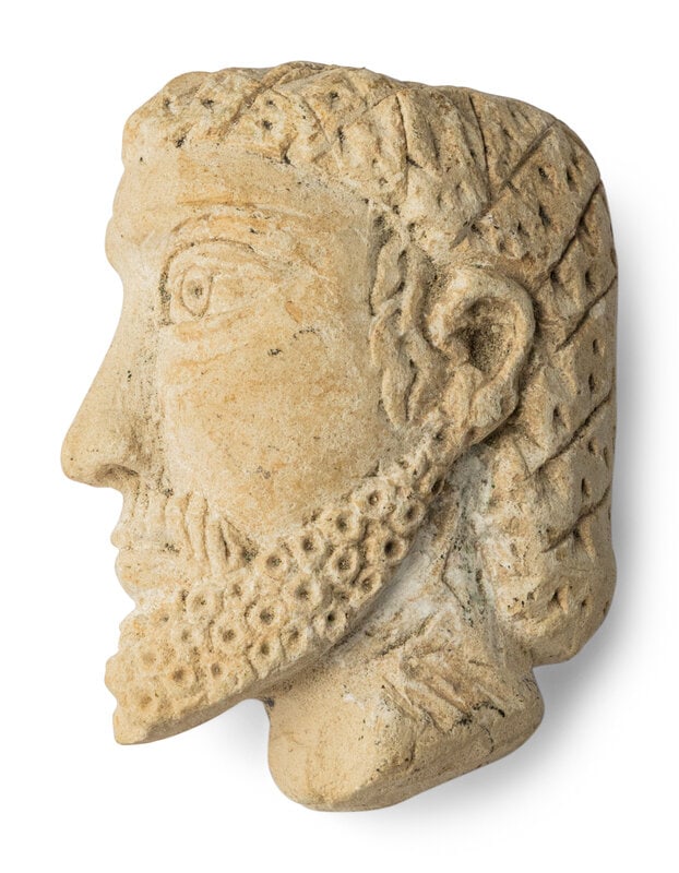A Palmyrene Limestone Head: A Palmyrene Limestone Head Circa 3rd-5th Century A.D. Height 5 cm (2 inches). Property from the Collection of Mr. Felix Brejente, Schaumburg, Illinois This lot is located in Ch