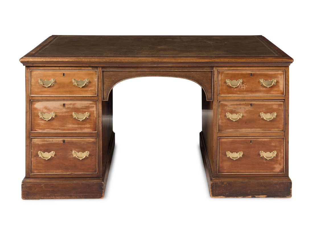 A George III Style Mahogany Pedestal Desk: A George III Style Mahogany Pedestal Desk 19th/20th Century Height 28 1/2 x width 54 x depth 32 inches. Property from Camp Rosemary, the Estate of Posy Krehbiel, Lake Forest, Illinois This lot is loca