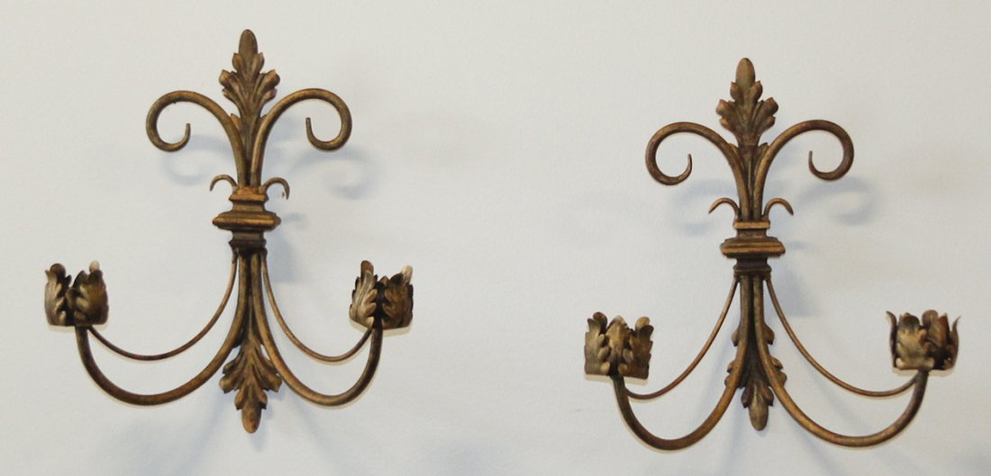 A Pair of Wrought Iron and Pressed Metal Two-Light Scon: A Pair of Wrought Iron and Pressed Metal Two-Light Sconces, having foliate accents. Height 13 1/2 inches.