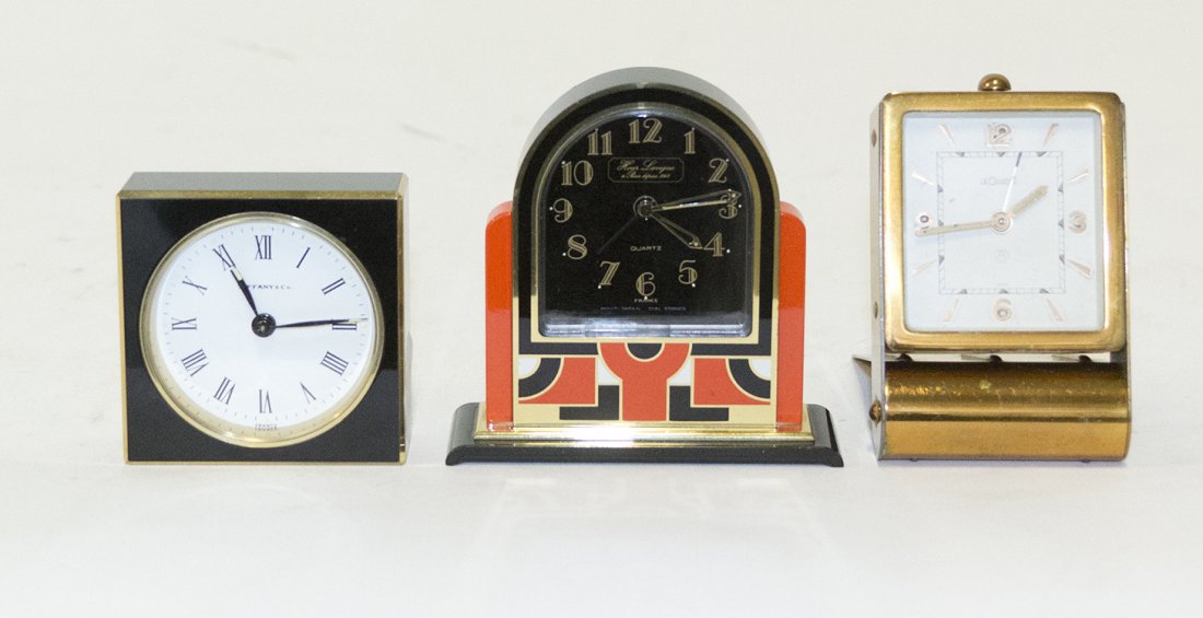 Three Desk Clocks, Height of tallest 3 1/2 inches.: Three Desk Clocks, comprising examples by Le Coultre, Tiffany & Co. and Hour Lavigne. Height of tallest 3 1/2 inches.