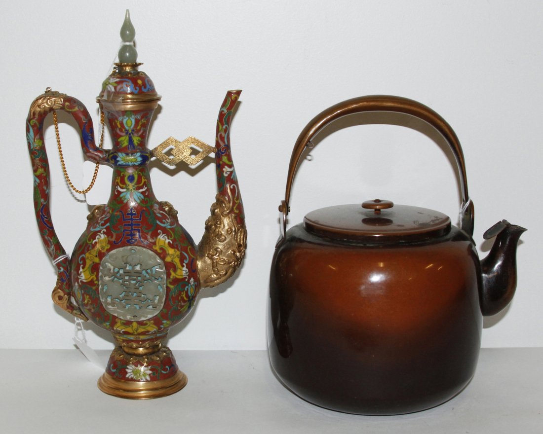 A Cloisonne Enamel Ewer, Height of taller 12 1/4 inches: A Cloisonne Enamel Ewer, having bat and scrolled lotus decoration on a red ground, with hardstone plaque and finial, with gilt metal mounts, together with a copper tea pot. Height of taller 12 1/4 inc