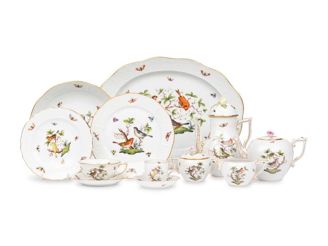 A Herend Rothschild Bird Porcelain Dinner Service: A Herend Rothschild Bird Porcelain Dinner Service 20th Century comprising: 9 dinner plates 4 salad plates 6 dessert plates 7 teacups and 13 saucers 8 coffee cups and 11 saucers 1 coffee pot 1 teacup 1