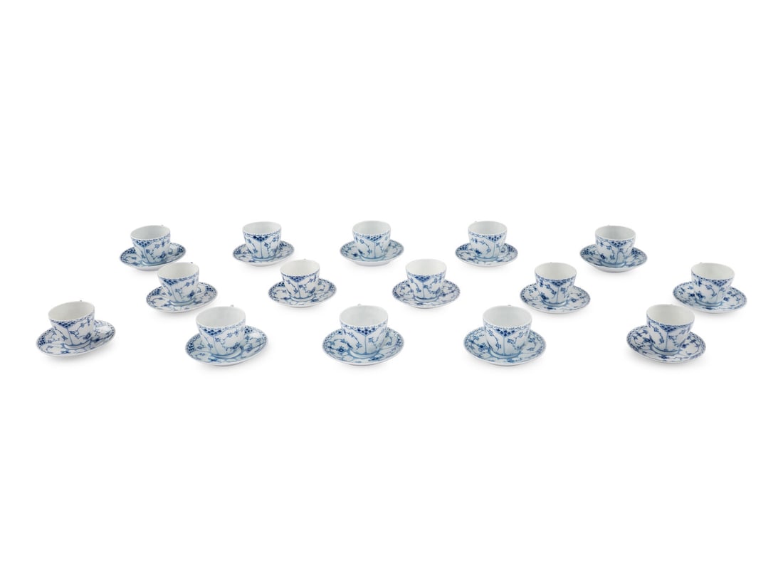 A Group of Royal Copenhagen Blue Fluted Teacups and Saucers: A Group of Royal Copenhagen Blue Fluted Teacups and Saucers 20th Century comprising 20 teacups and 24 saucers, each with green crown and blue three wave marks to underside. Height of cups 2 3/8 inches