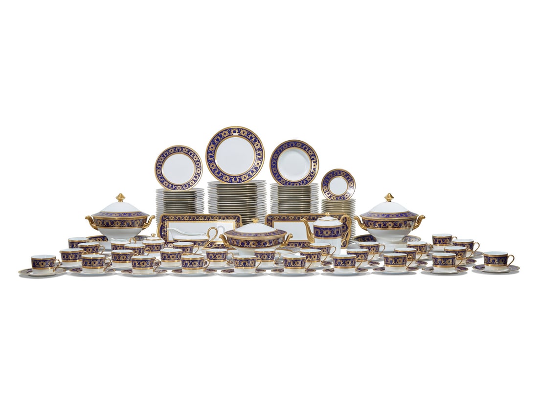 A Tharaud-Limoges Parcel Gilt and Cobalt Decorated Porcelain Dinner Service
