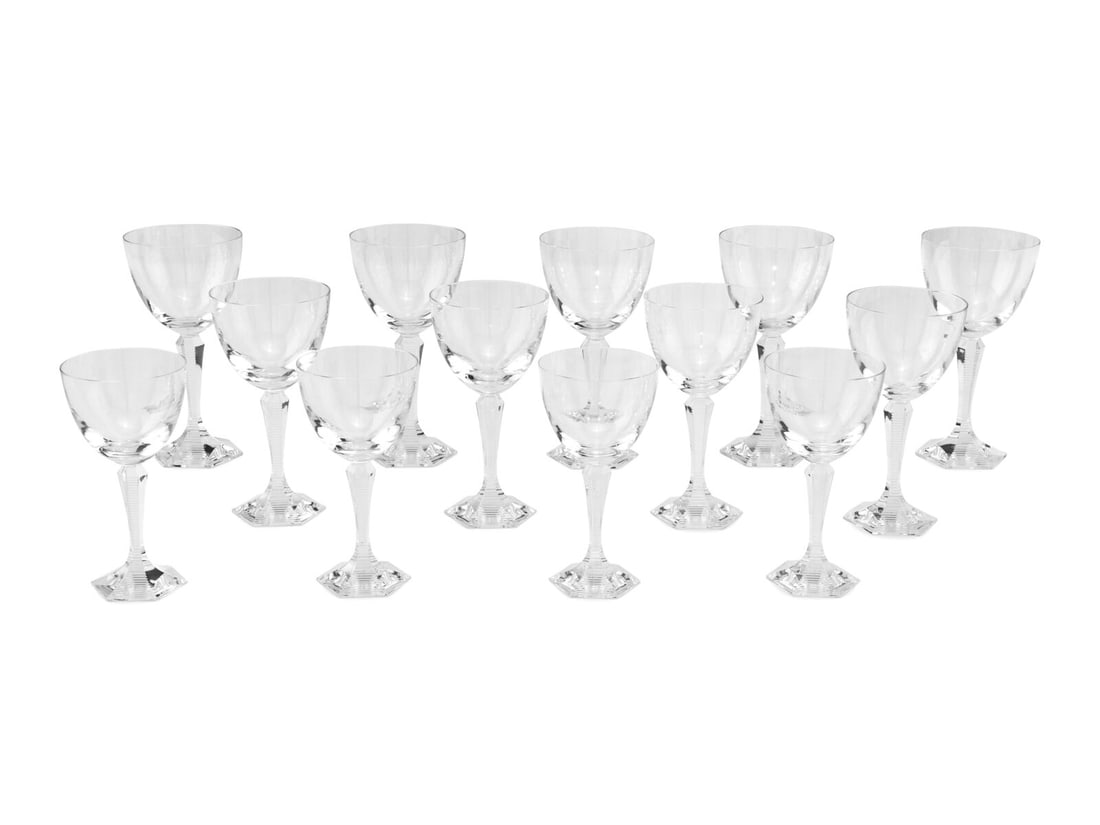 A Baccarat Opera Stemware Service: A Baccarat Opera Stemware Service comprising: 5 water goblets 4 white wine glasses 4 red wine glasses; 13 pieces total. Height of water goblets 7 1/2 inches. This lot is located in Chicago.