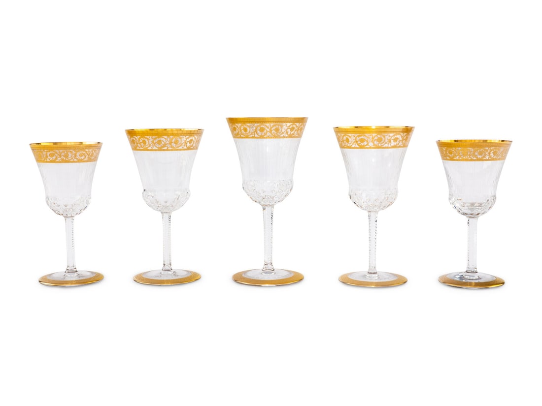 A Staint-Louis Thistle Gilt Stemware Service: A Staint-Louis Thistle Gilt Stemware Service 20th Century each with etched Saint-Louis mark to underside, comprising: 23 water goblets 21 red wine glasses 24 white wine glasses; 68 items total. Height