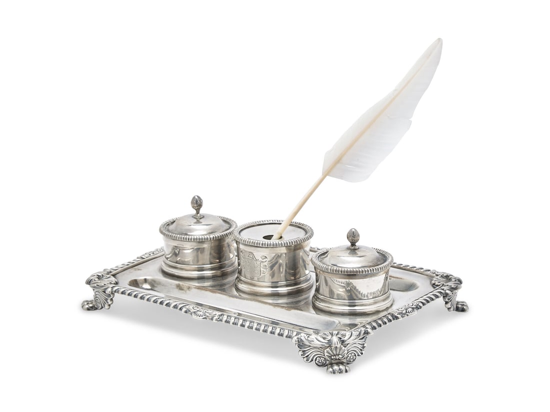 A George III Silver Ink Stand: A George III Silver Ink Stand Matthew Boulton, Birmingham, 1817 the center container engraved with coat-of-arms, the two side containers engraved with armorial crest in the form of a Classical helmet,