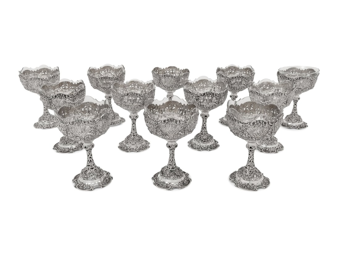 A Set of Twelve German Silver Wine Stems: A Set of Twelve German Silver Wine Stems Early 20th Century each with a glass liner; marked with 800 standard to foot. 52 ozt 5 dwt weighable Height including liner 5 3/4 inches. Property from the Est