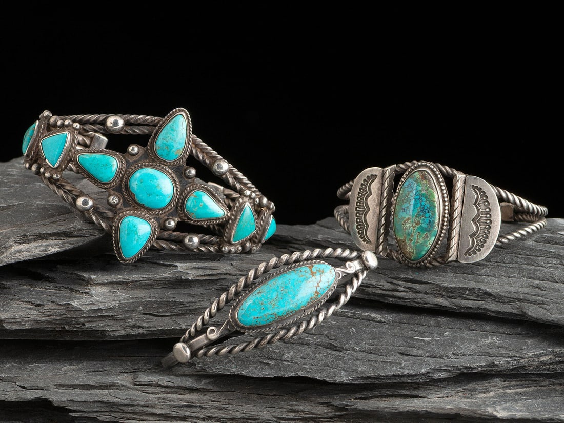 Navajo Twisted Wire and Turquoise Cuff Bracelets: Navajo Twisted Wire and Turquoise Cuff Bracelets second quarter - mid 20th century lot of 3, includes: one set with nine cabochons; etched with an encircled B width 1-3/4 inches, interior circumferenc