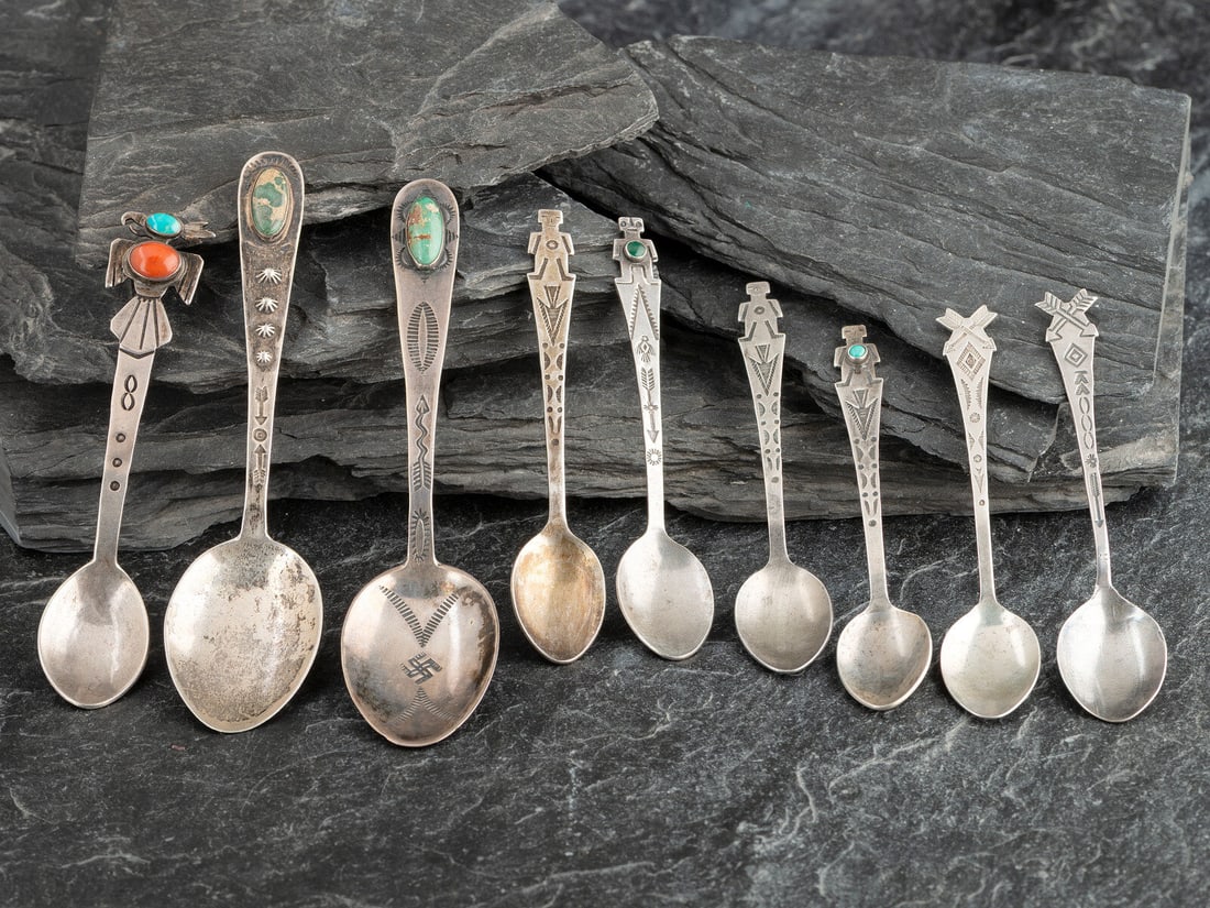 Navajo Silver Curio Spoons: Navajo Silver Curio Spoons first half 20th century lot of 9, includes: two with stamped handles and set with a single turquoise cabochon; not marked lengths 5 inches (each), combined weight 18.5 dwt. 