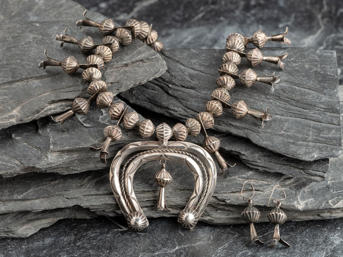 Navajo Silver Squash Blossom Necklace and Hook Earring Set: Navajo Silver Squash Blossom Necklace and Hook Earring Set second quarter - mid 20th century strung with fluted beads and a stamped double-crescent naja; not marked necklace length 25-1/2 inches, naja