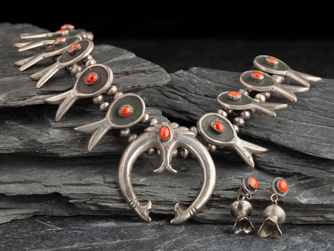 Navajo Silver and Coral Squash Blossom Necklace and Post Earrings: Navajo Silver and Coral Squash Blossom Necklace and Post Earrings mid - third quarter 20th century not marked necklace length 25-1/2 inches, naja length 2-1/2 inches x width 2 inches, weight 120.8 dwt