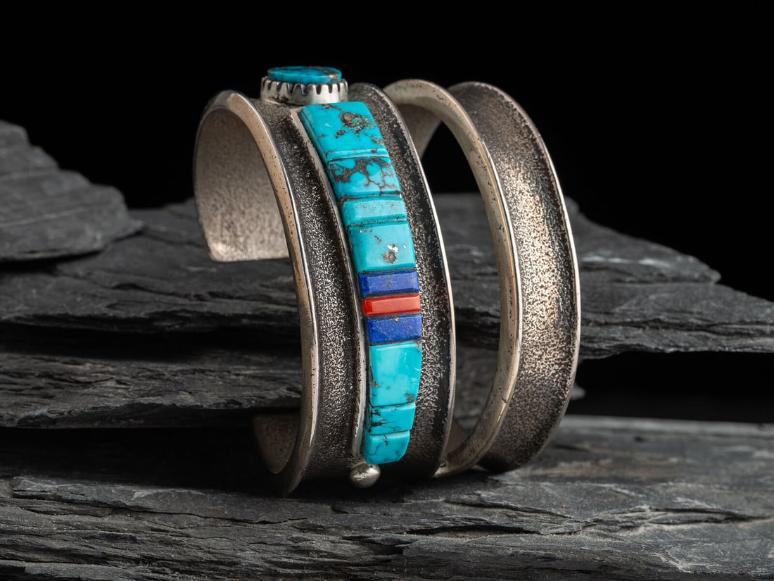 Edison Cummings (Diné, b. 1962) Tufa Cast Silver Cuff Bracelet, with Abstract Figural Inlay (1 of 2)