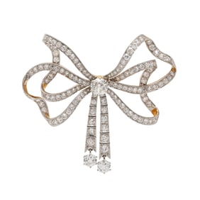 EDWARDIAN, DIAMOND AND PLATINUM-TOPPED GOLD BOW BROOCH
