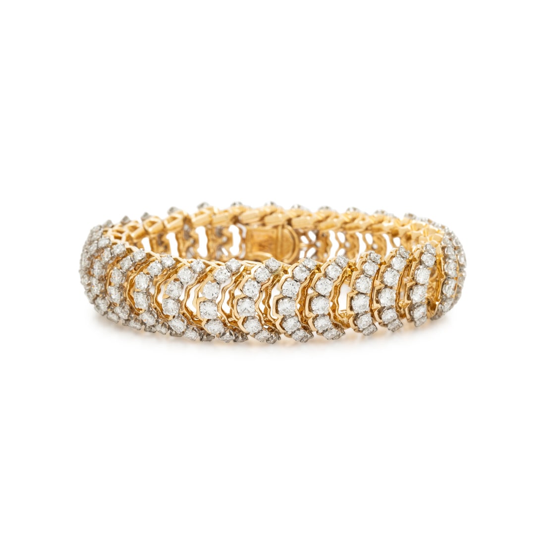 CARTIER, DIAMOND AND YELLOW GOLD BRACELET: CARTIER, DIAMOND AND YELLOW GOLD BRACELET In an articulated link design, featuring round diamonds weighing approximately 14.00 carats total. Mounted in 18 karat yellow gold. 7 inches long. Stamp: (par