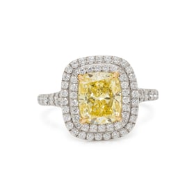 TIFFANY & CO., FANCY INTENSE YELLOW DIAMOND, DIAMOND, AND PLATINUM 'SOLESTE' RING