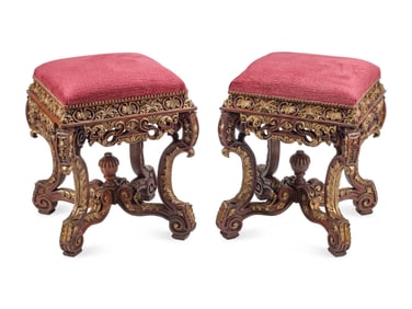 A Pair of Régence Style Carved and Parcel Gilt Stools