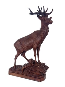A Swiss Black Forest Carved Stag