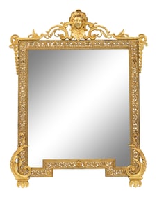 A Continental Gilt Cast Metal Mirror