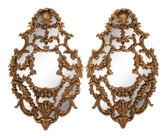 A Pair of Italian Giltwood Oval Mirrors