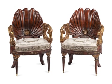 A Pair of Neoclassical Style Carved Walnut and Parcel-Gilt Shell-Form Armchairs
