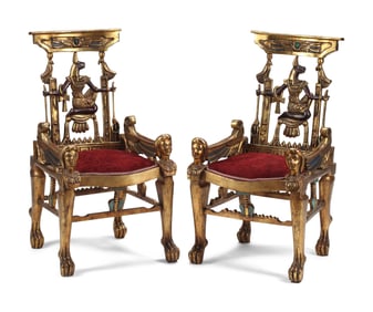 A Pair of Egyptian Style Painted and Parcel-Gilt Armchairs