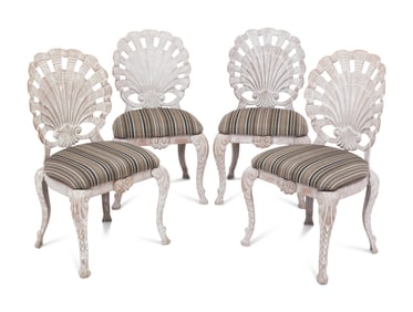 A Set of Four "Grotto" Style Cast Metal Chairs