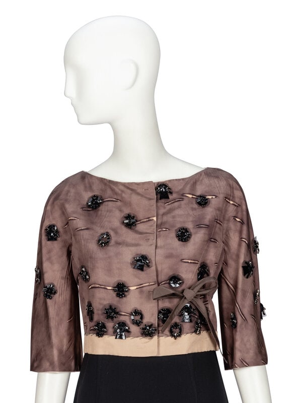 Prada, Embellished Silk Jacket: Prada, Embellished Silk Jacket Cropped evening jacket in printed taupe silk faille with all-over jet bead & tulle embellishments. Wide bateau neckline. Elbow-length incorporated sleeves. Fabr