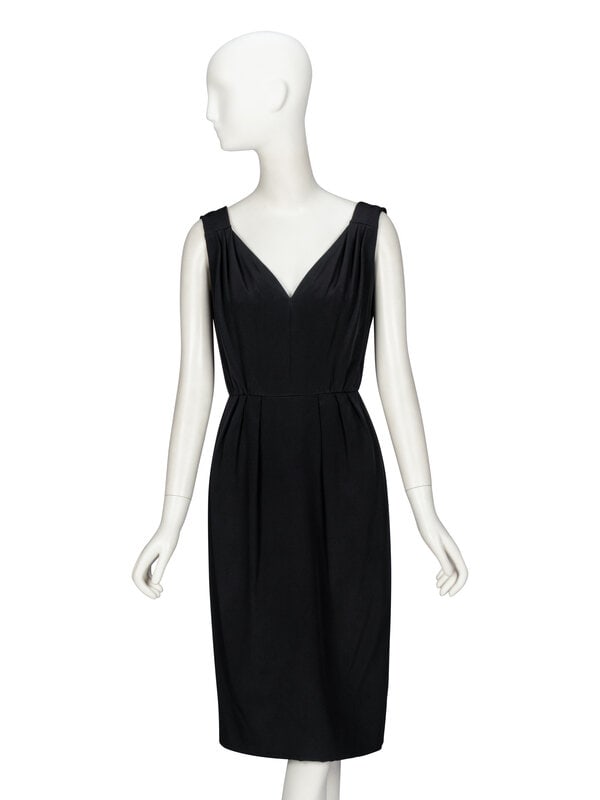 Galanos, Black Bespoke Cocktail Dress: Galanos, Black Bespoke Cocktail Dress Cocktail dress in black silk crêpe de chine. V-neckline with pleats at bodice. Knee-length pencil skirt with pleats at waistline. Zipper closure at back